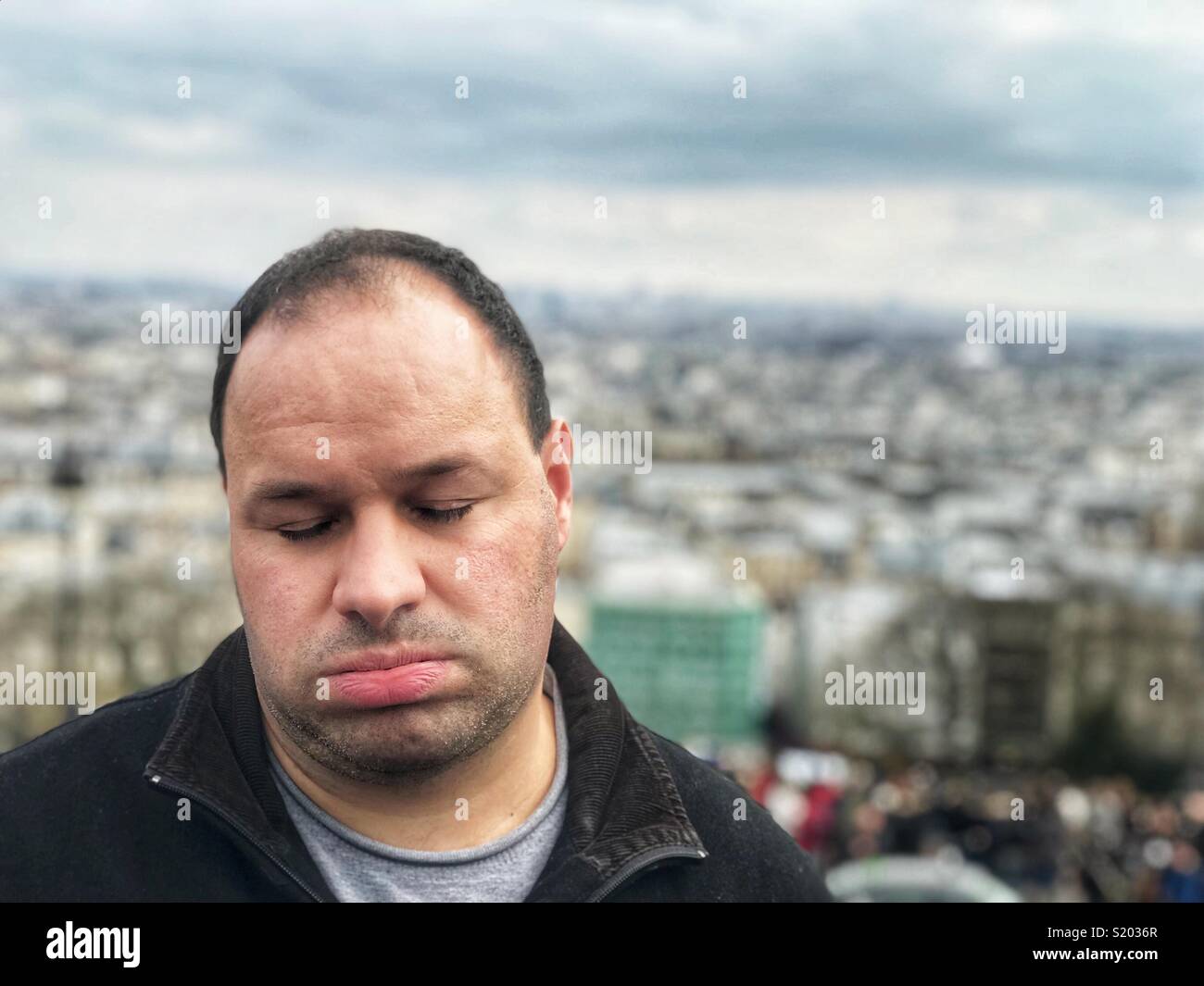Exhausted man Paris France - Smartphone Captured Stock Image