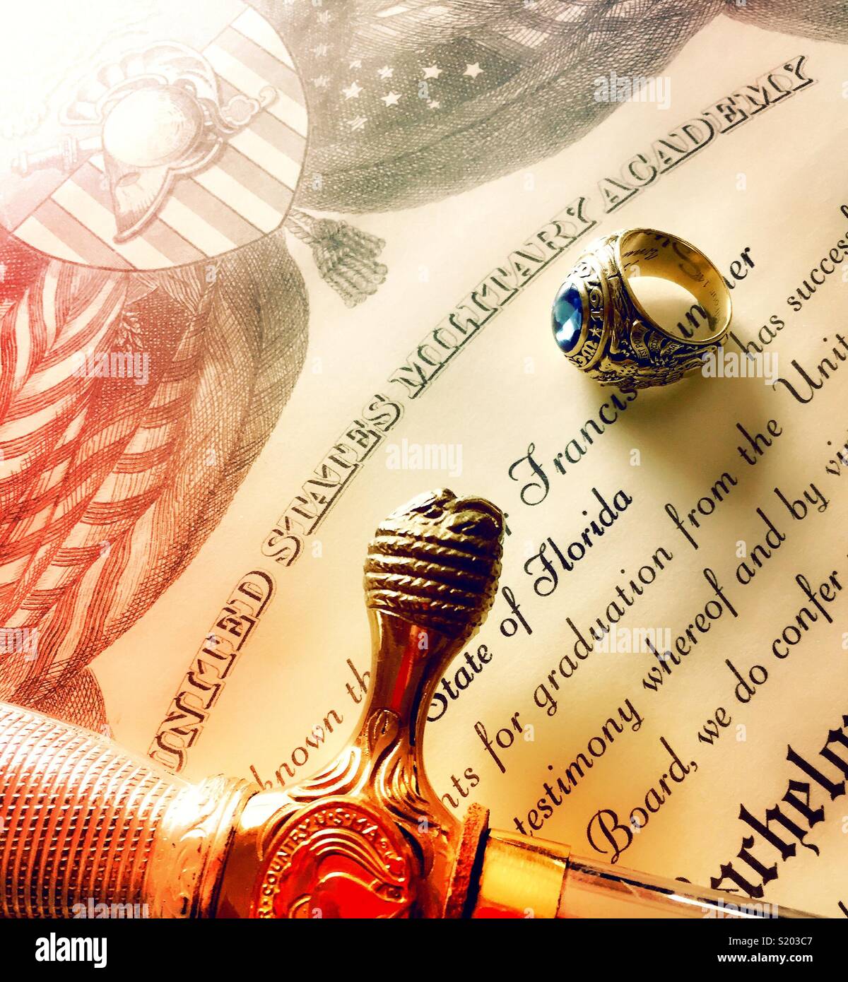 Ring and saber on west point diploma detail close-up, United States military Academy, USA - Smartphone Captured Stock Image