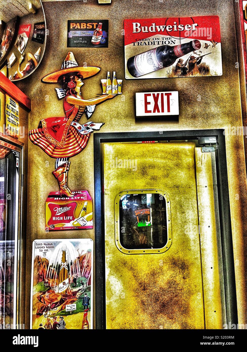 Old beer signs over an exit door - Smartphone Captured Stock Image