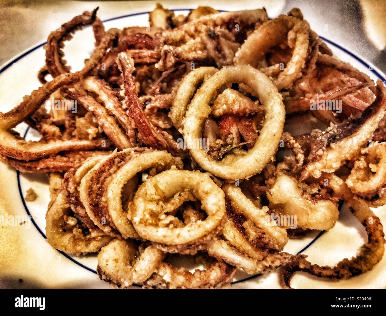 Deep fried baby squid in batter, in a Spanish tapas bar Stock Photo - Alamy
