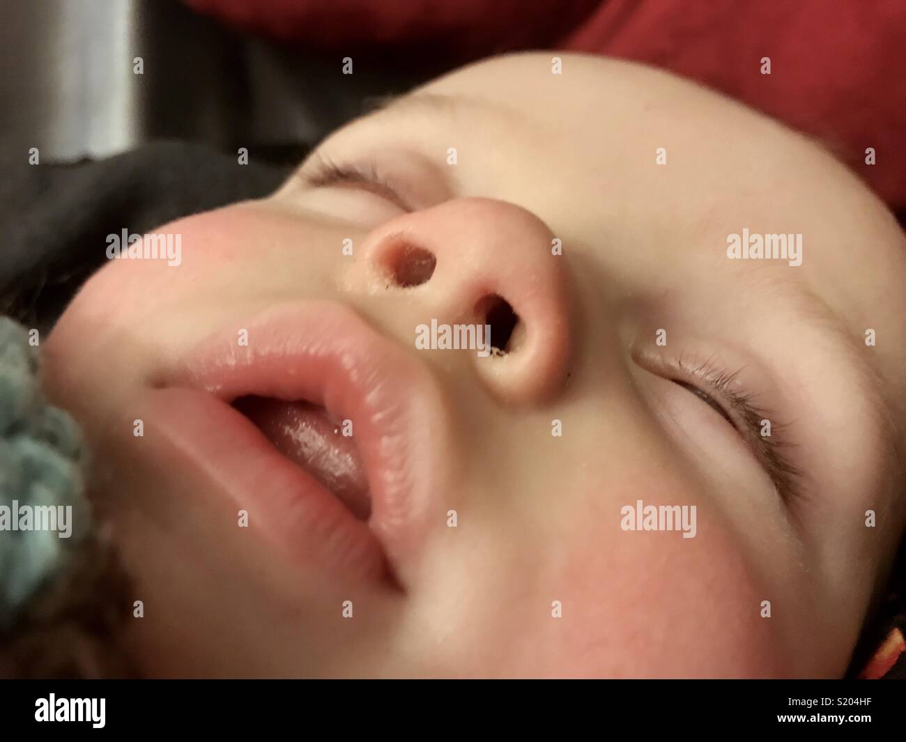 Close up of a 7 month old baby’s sleeping face. Stock Photo