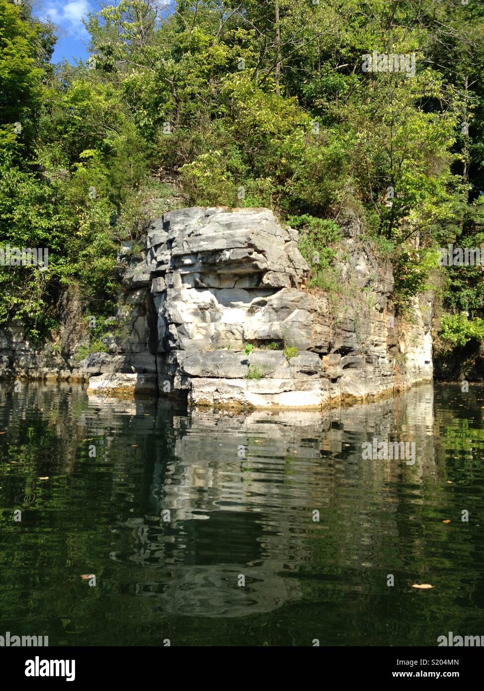 Rock formation with lake Stock Photo - Alamy