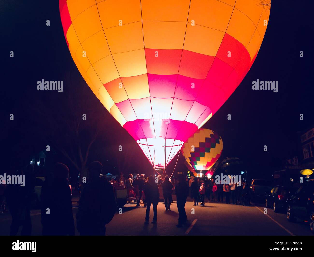 A glowing hot air balloon at the Balloons and Tunes Festival in Kanab, Utah in March, 2018. Stock Photo