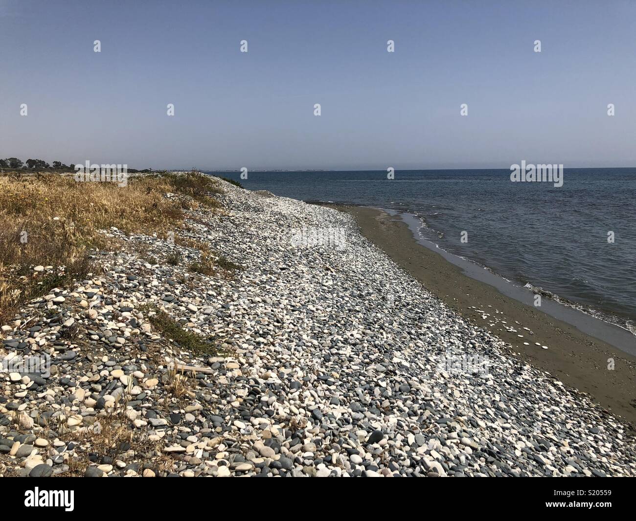 Beach with pebbles and grey sand on Cyprus - Smartphone Captured Stock Image