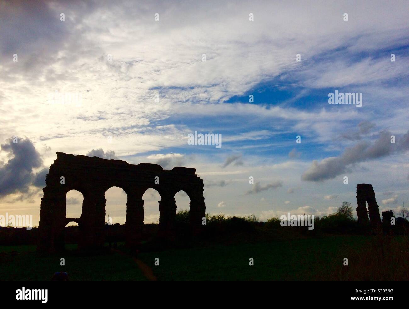 Silhouette of the ancient Rome aqueducts Stock Photo