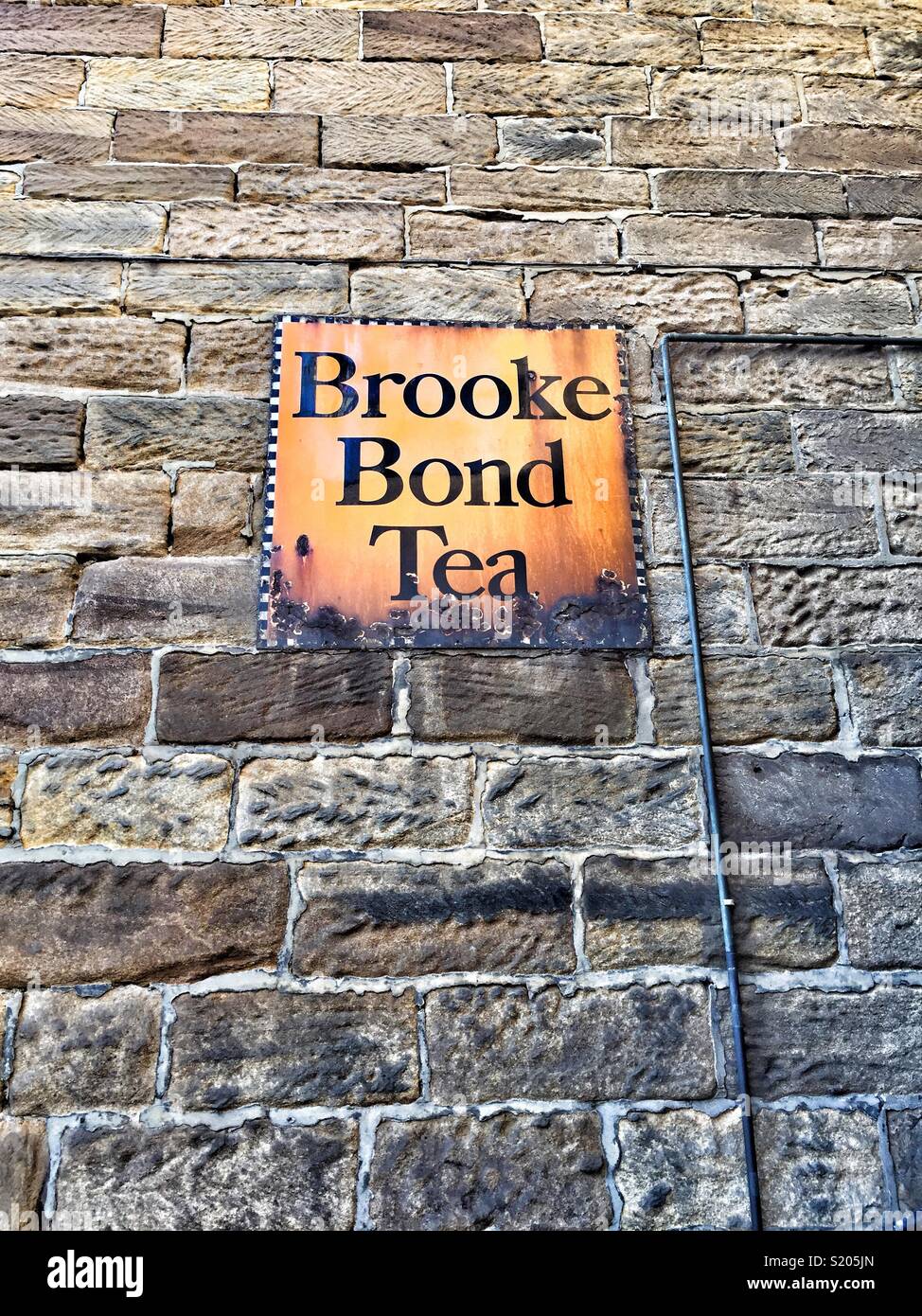 brooke Bond tea signage, Robin Hood’s Bay, North Yorkshire, UK - Smartphone Captured Stock Image