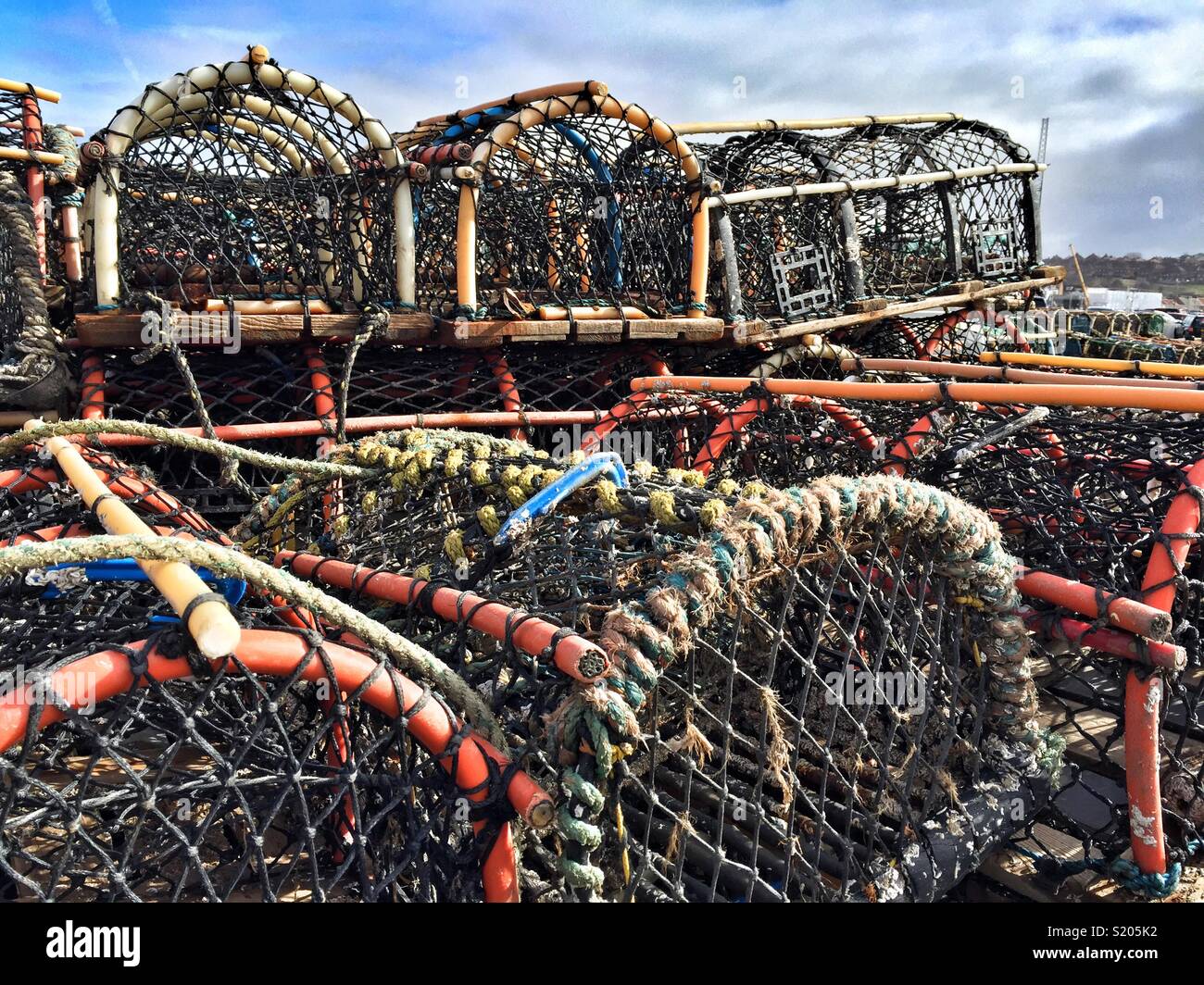 Lobster pots piled high in Whitby, North Yorkshire, UK - Smartphone Captured Stock Image