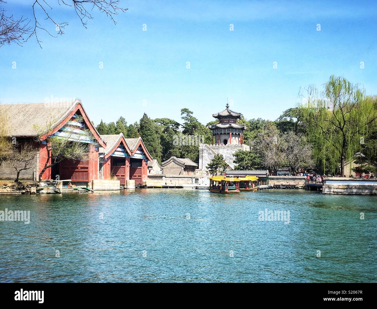 Docks and temple by the lake at the Summer Palace in Beijing, China - Smartphone Captured Stock Image