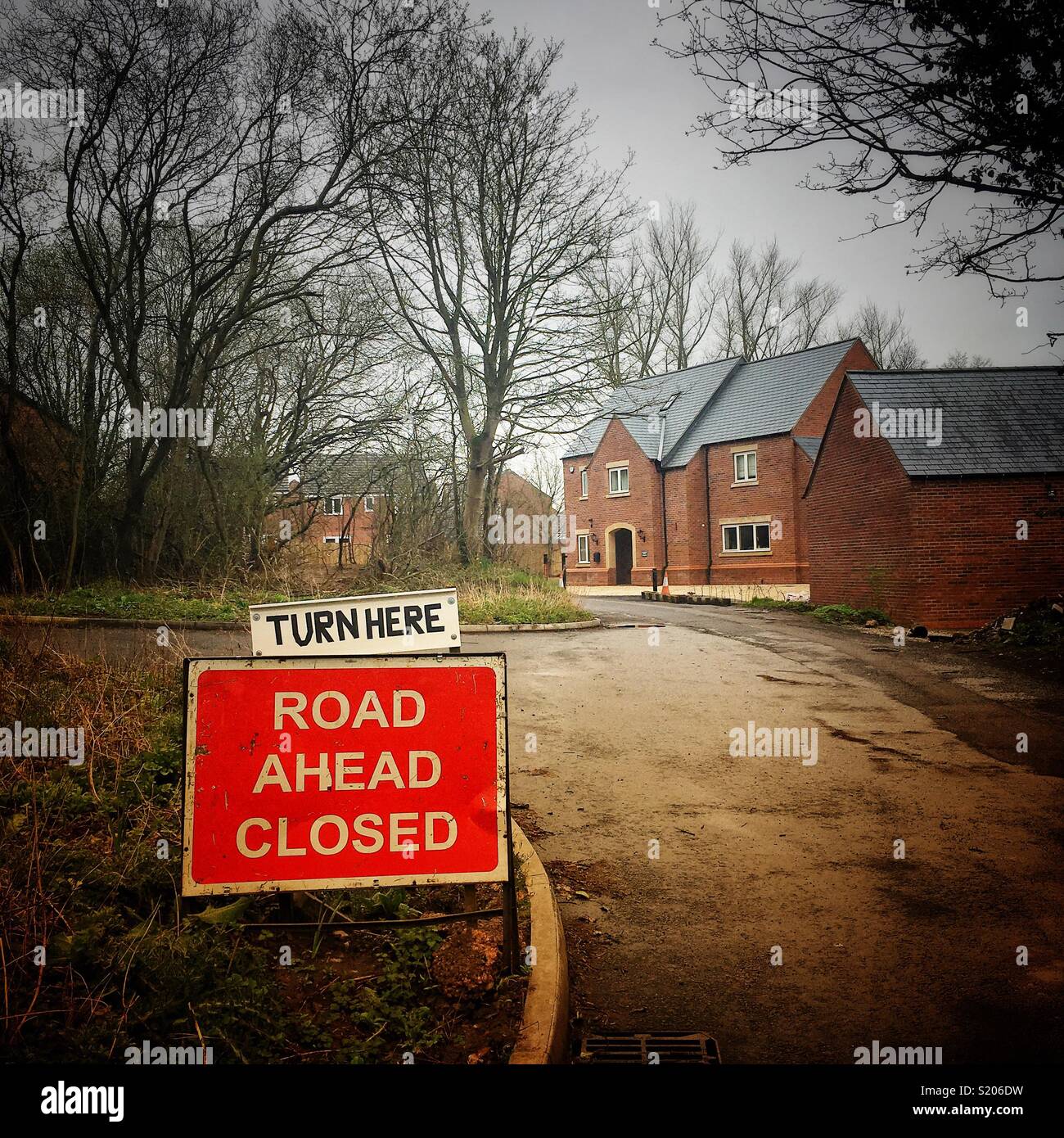 Road closed with home made “turn here” sign in Cheshire UK - Smartphone Captured Stock Image