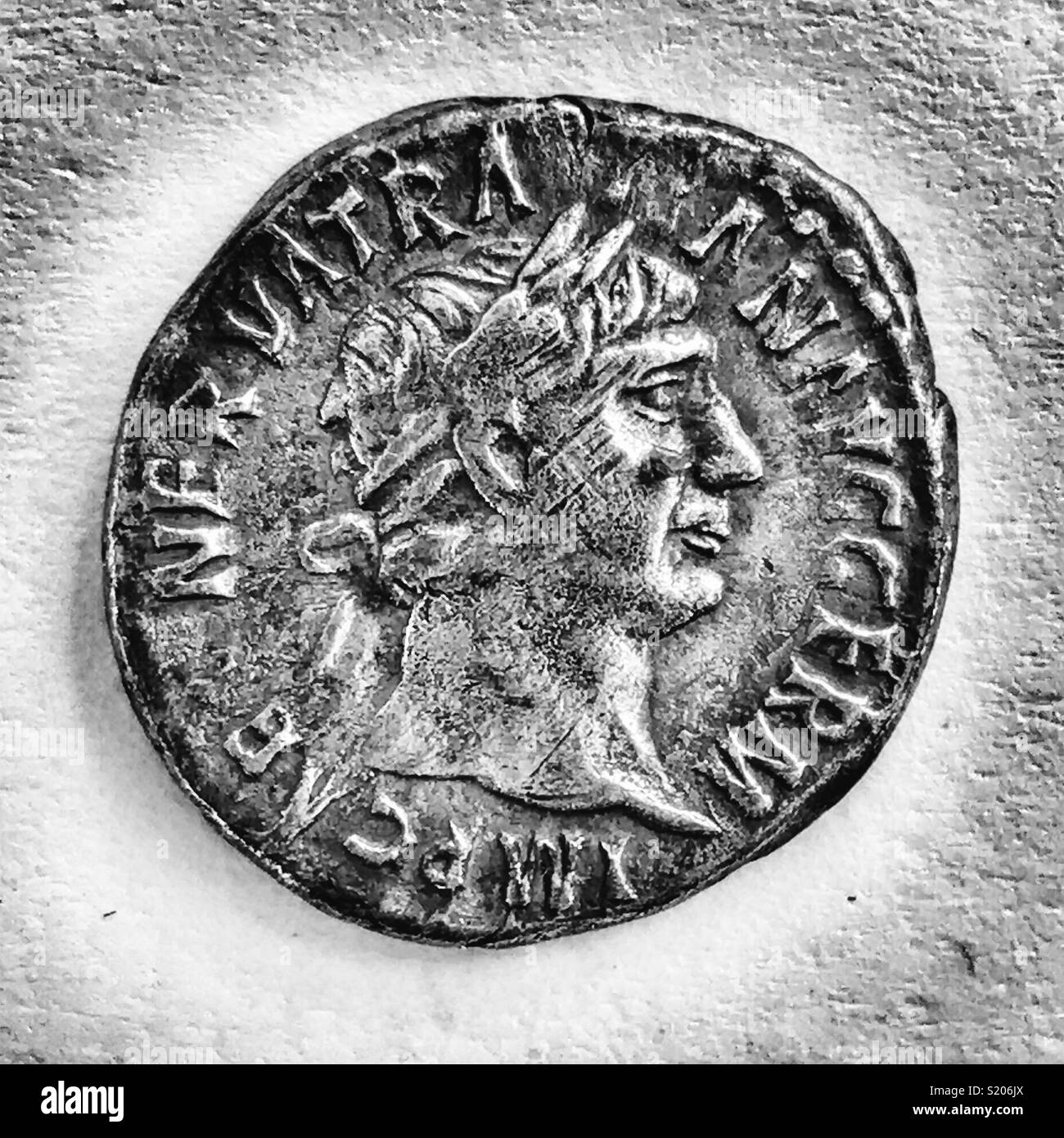 Roman coin, detail of silver denarius with a bust of the Emperor Trajan, facing right Stock Photo