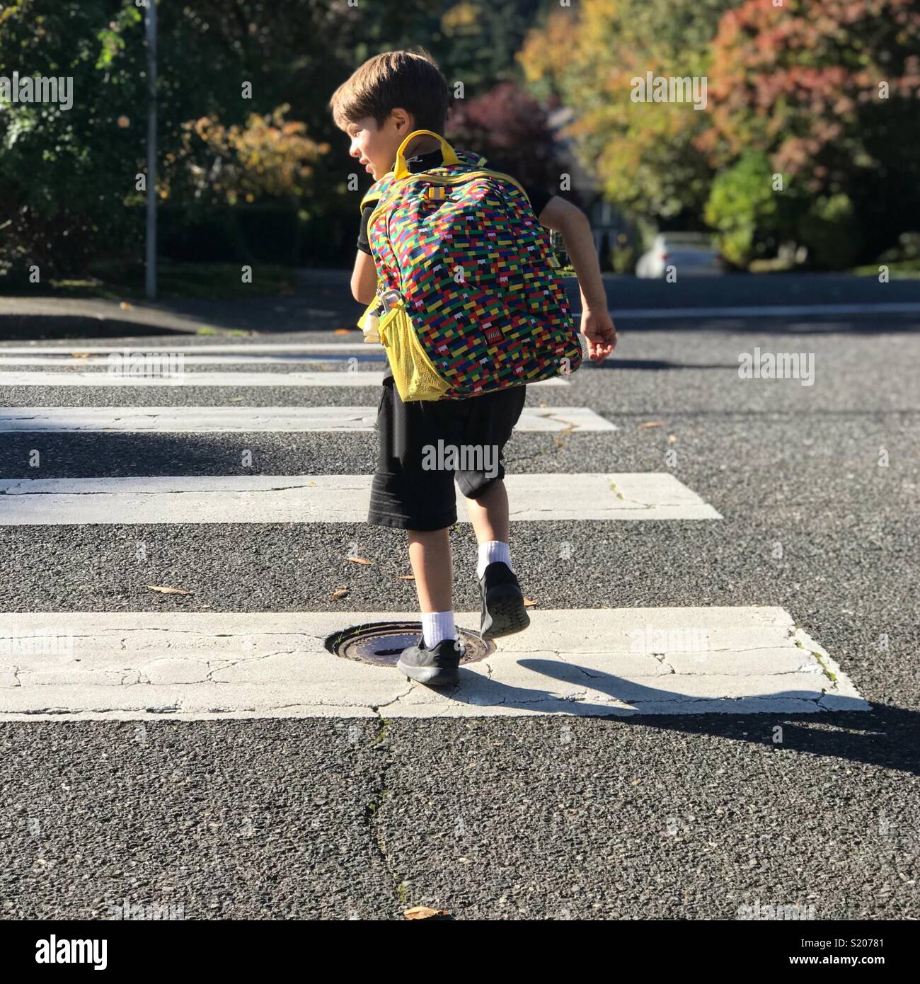 kid running with backpack