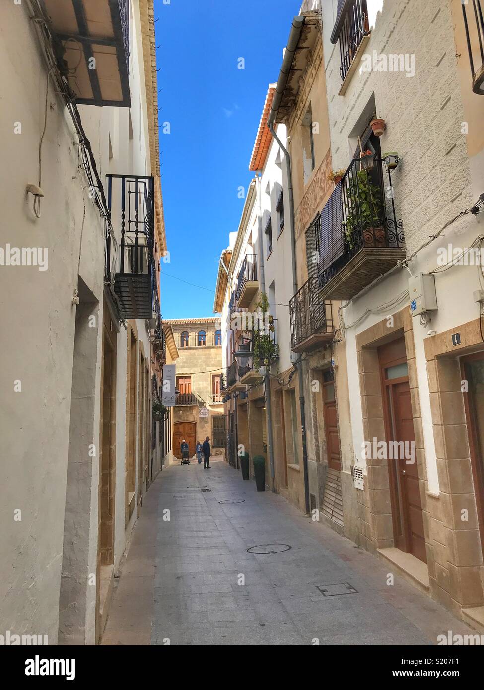 Typical narrow street in the Old Town of Javea / Xabia, Alicante Province, Comunidad Valenciana, Spain - Smartphone Captured Stock Image