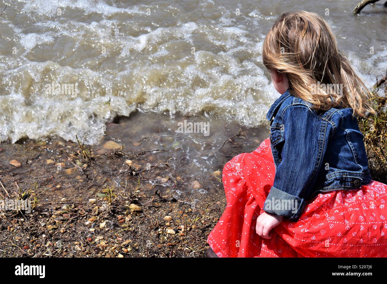 Little Girl by the Lake Shore Stock Photo - Alamy