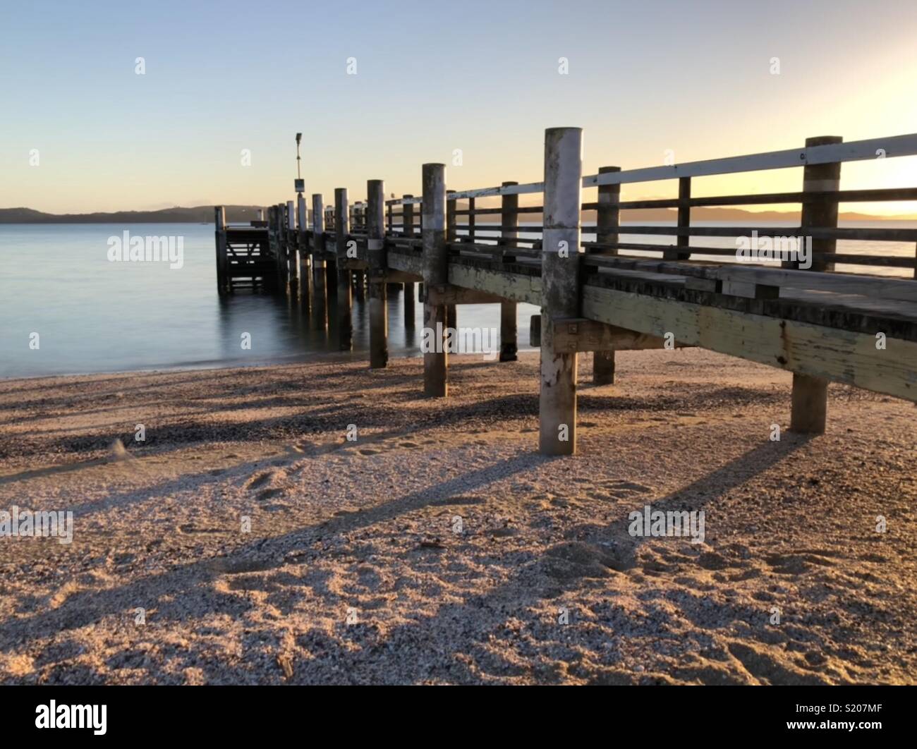 Sun rising over New Zealand beach - Smartphone Captured Stock Image