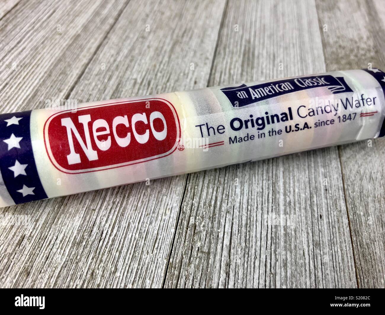 Roll of Necco wafers on a wood surface - Smartphone Captured Stock Image