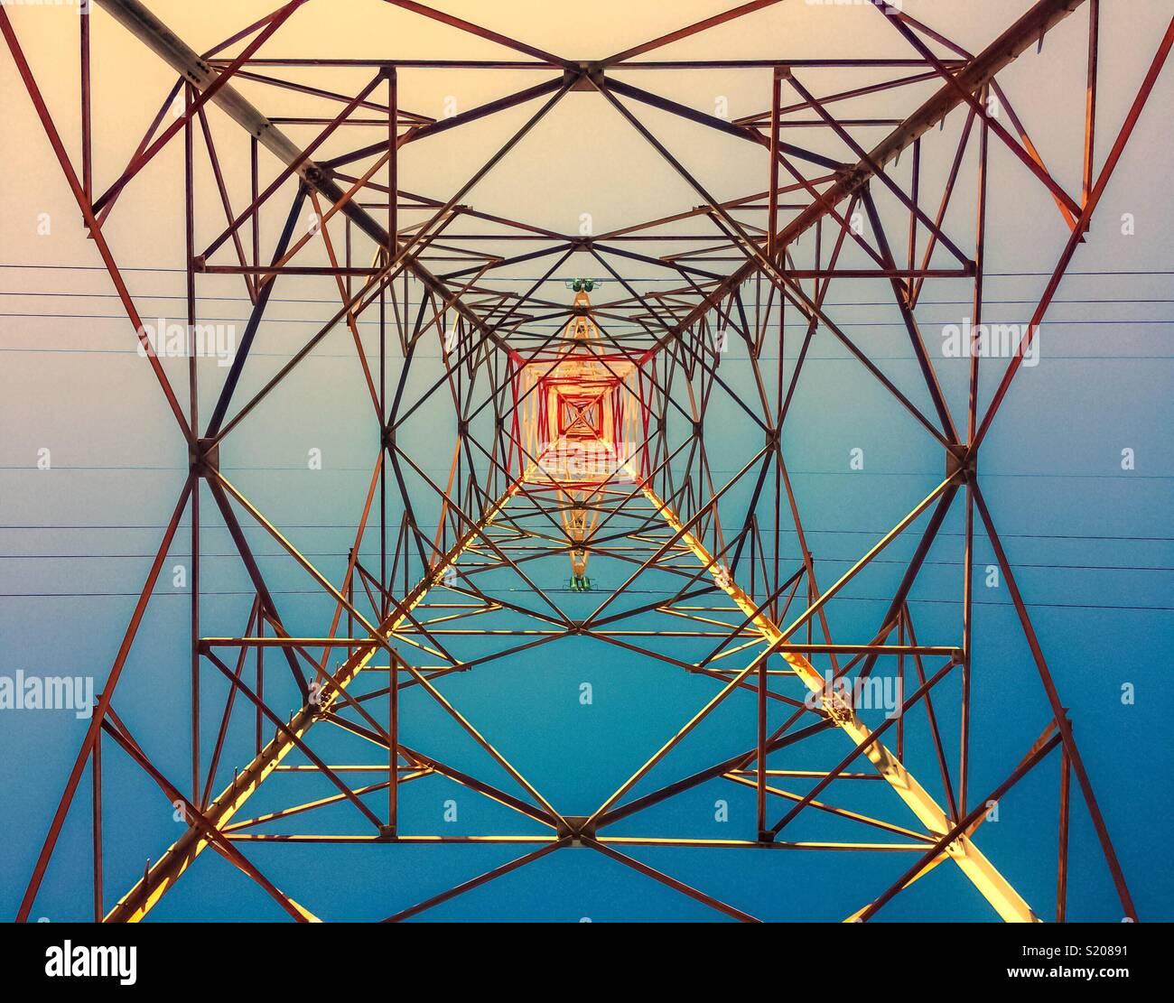 Geometrical metallic structure of high voltage electric tower, looking up, France. - Smartphone Captured Stock Image