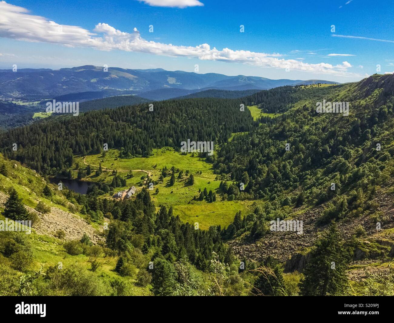 Summer in the mountains: scenic overlook on a green valley from the Gazon du Faing in the Vosges, France. - Smartphone Captured Stock Image