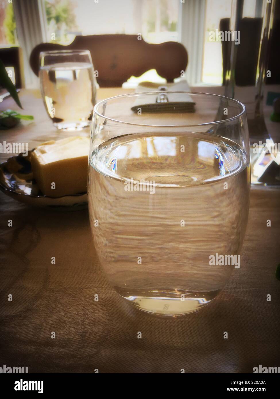 Glass of water and table setting - Smartphone Captured Stock Image
