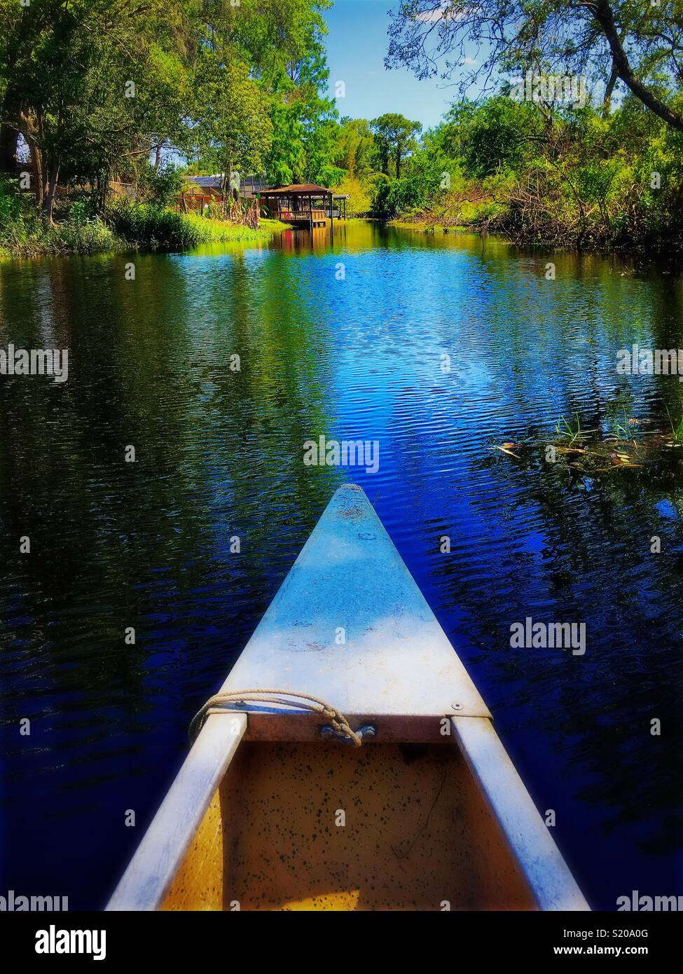 Canoeing through river Stock Photo