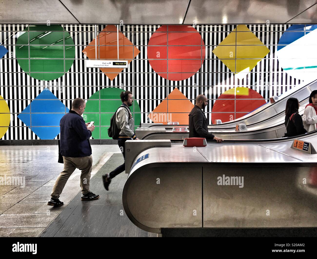 People leave Tottenham Court Road Underground station in London, England - Smartphone Captured Stock Image