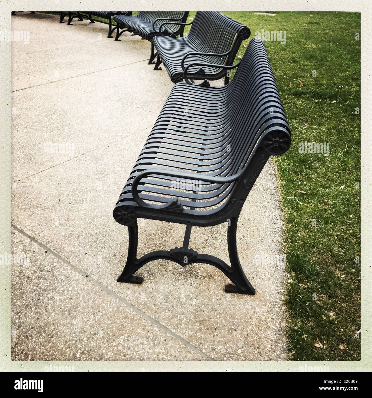 Park Benches in semi circle Stock Photo