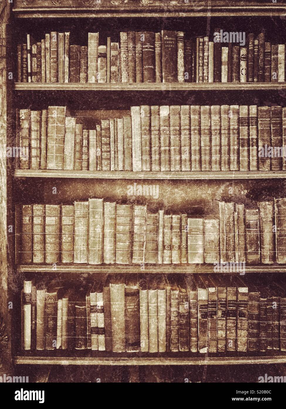 A grunge effect picture of an old book case that houses antique books. An antique effect image of an antique subject. Photo Credit - © COLIN HOSKINS. - Smartphone Captured Stock Image