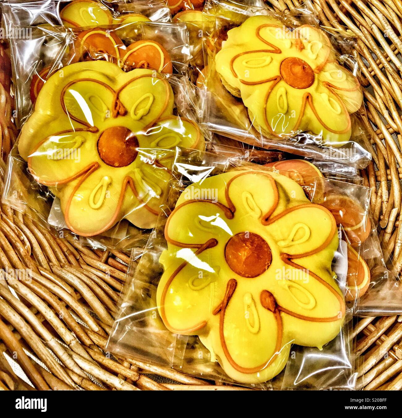 Frosted Sunflower cookies in wicker basket - Smartphone Captured Stock Image