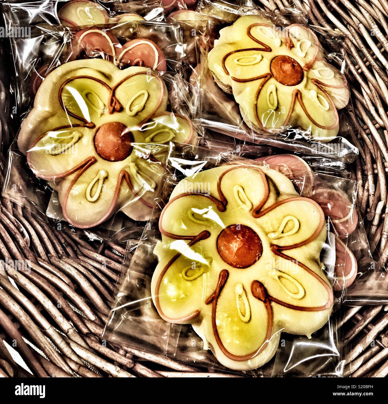 Frosted Sunflower cookies in wicker basket - Smartphone Captured Stock Image