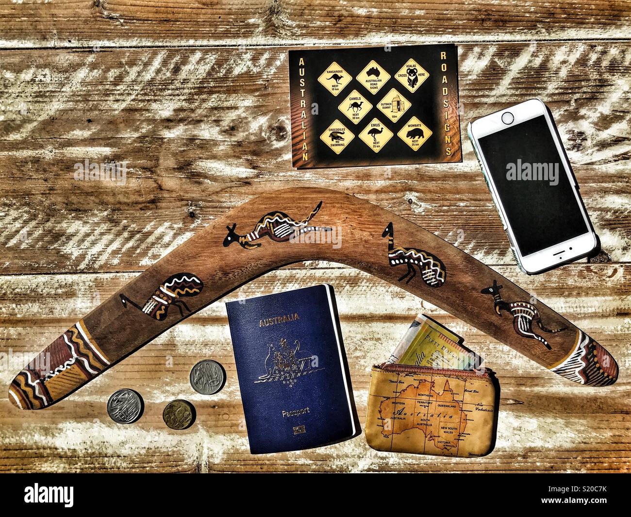 Flatlay photography, Australia holiday travel theme, boomerang, Australian passports, postcard, purse, AUD $, money, mobile phone - Smartphone Captured Stock Image