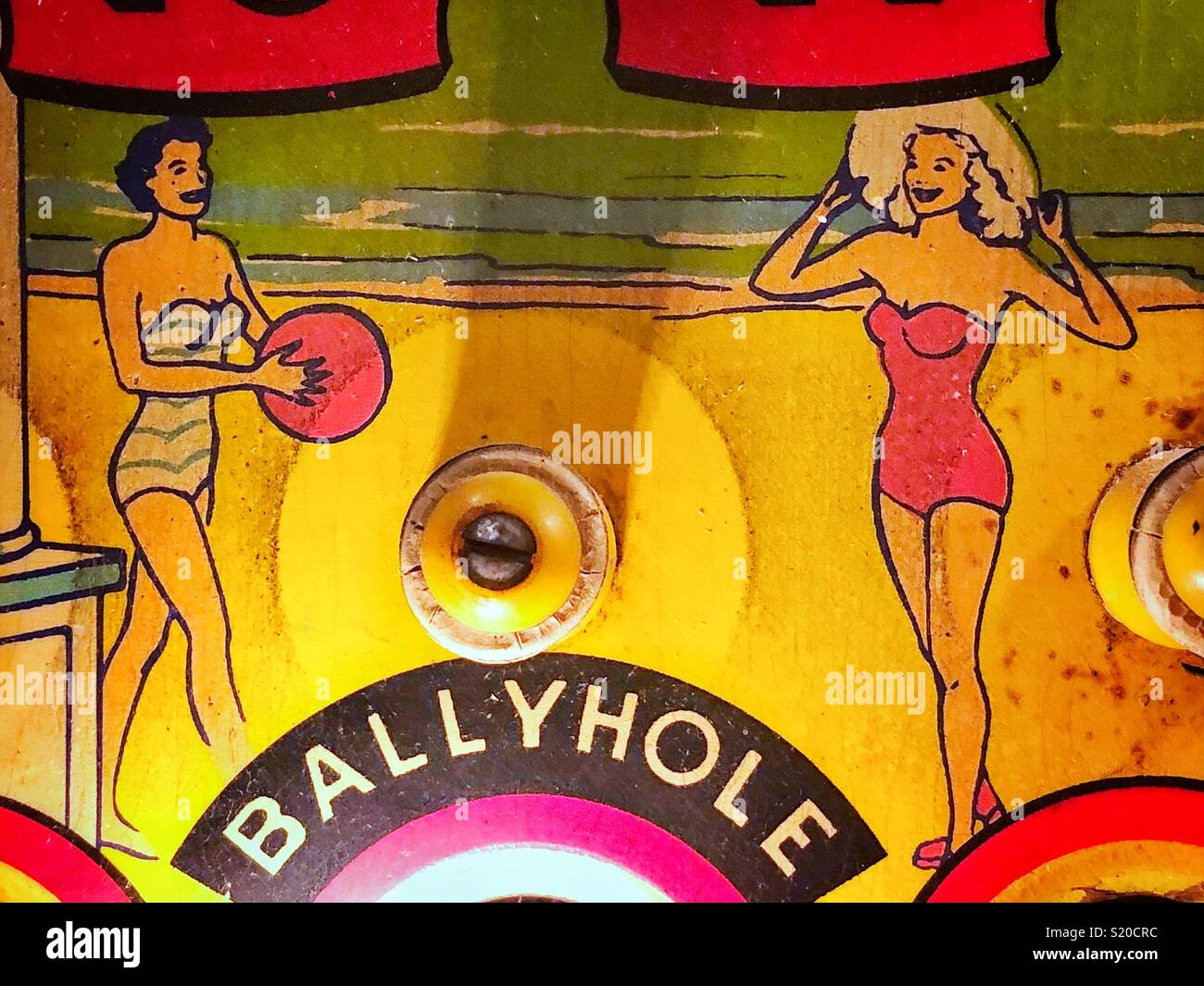 Detail of two pinup girls painted on vintage pinball machine Stock Photo