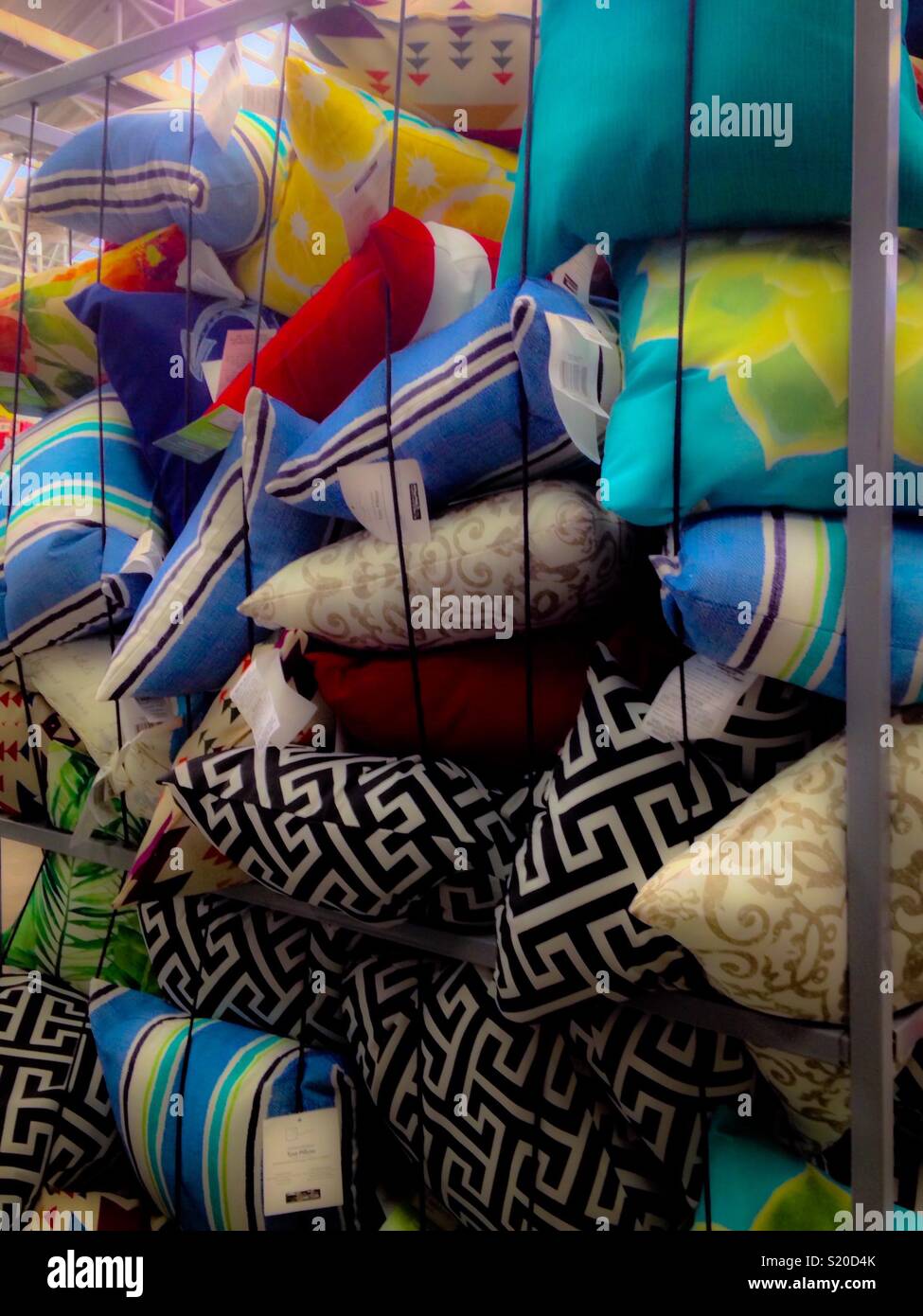 Bright pillows displayed in bin Stock Photo Alamy