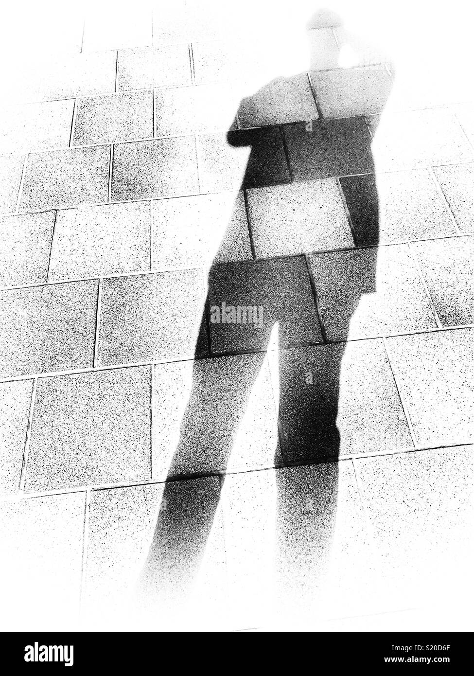 Human shadow on a tiled floor - Smartphone Captured Stock Image
