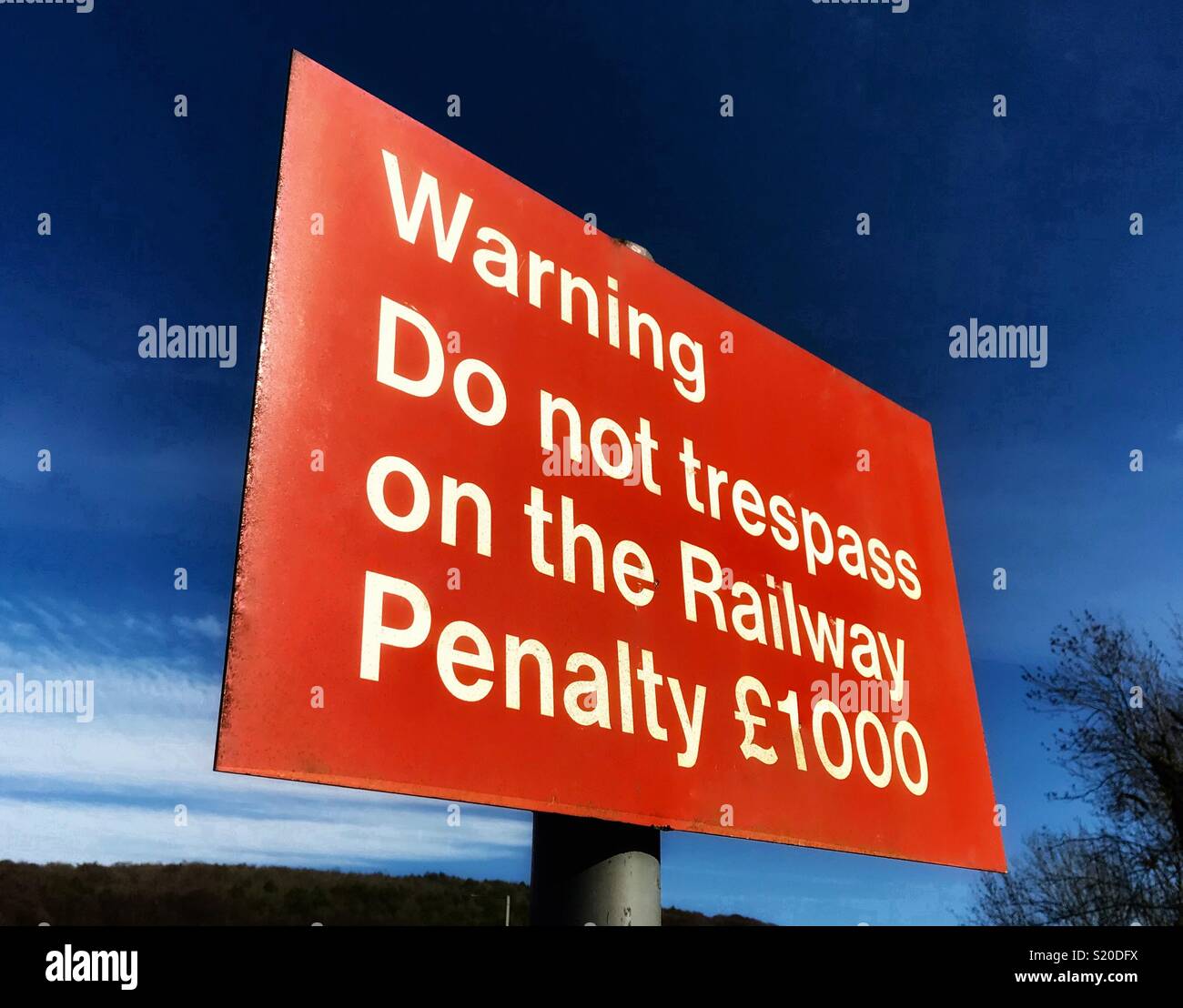 Warning sign at a railway foot crossing Stock Photo