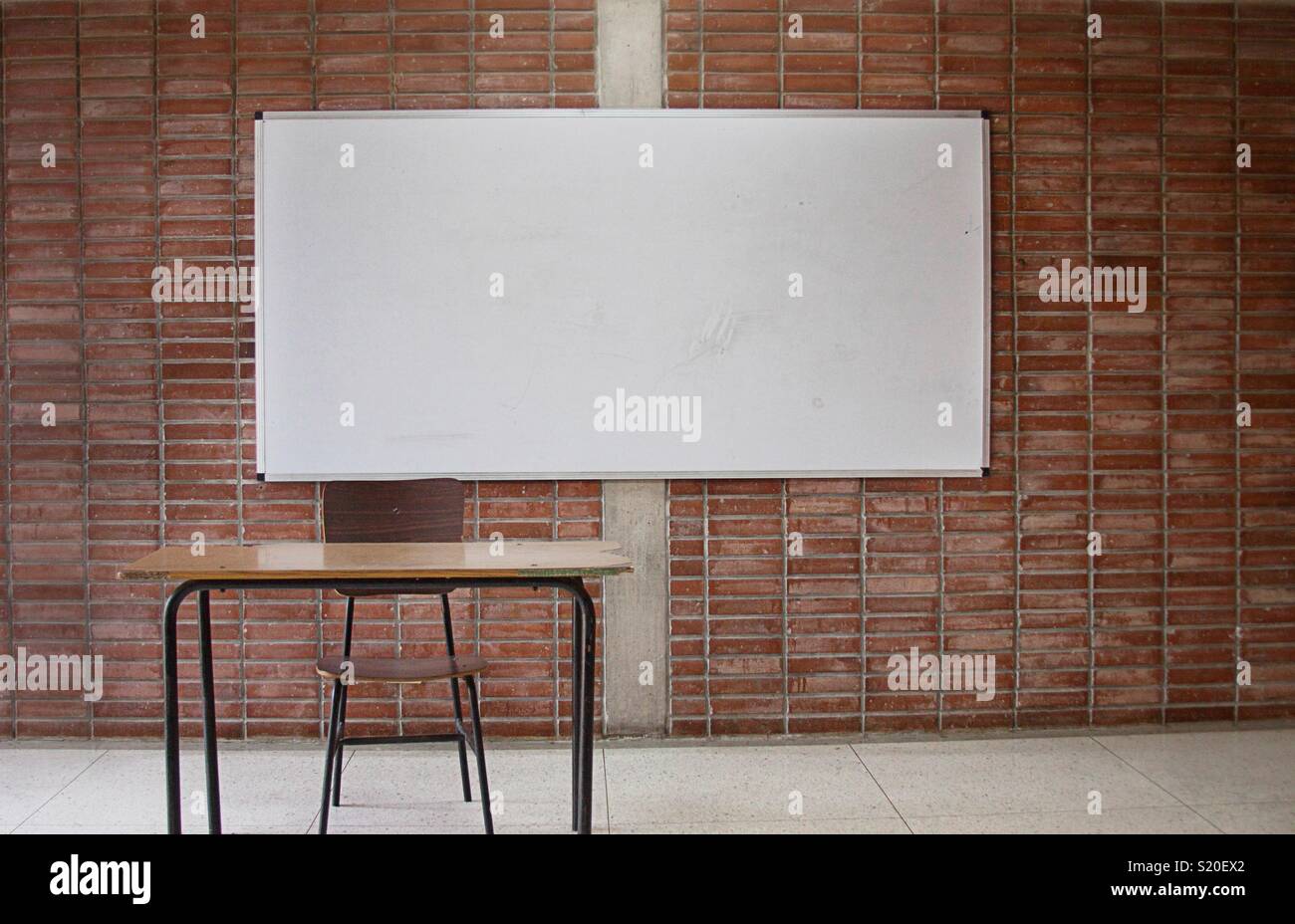 Empty Teachers Desk inside University classroom - Smartphone Captured Stock Image