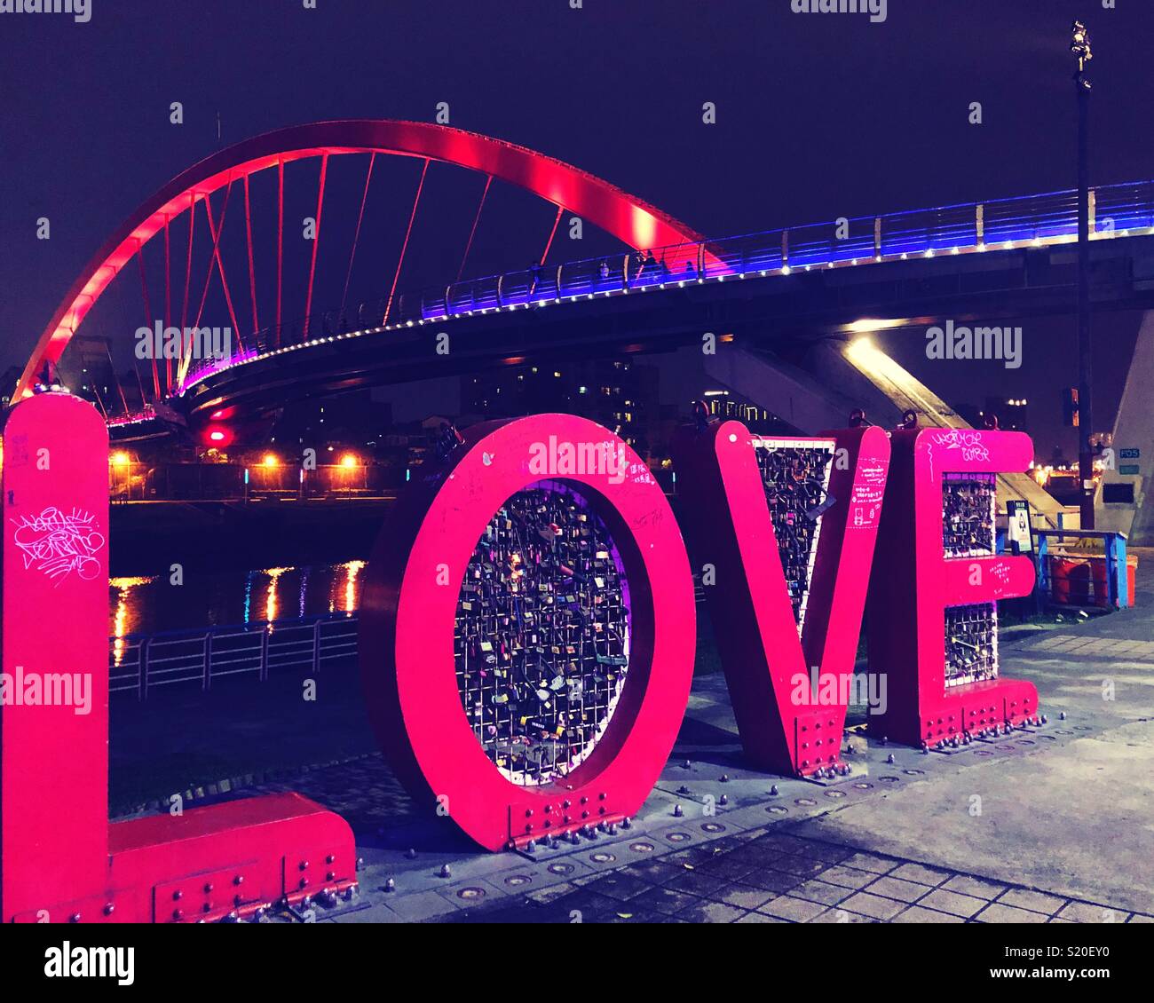 Love locks along the Keelung River in Taipei. - Smartphone Captured Stock Image