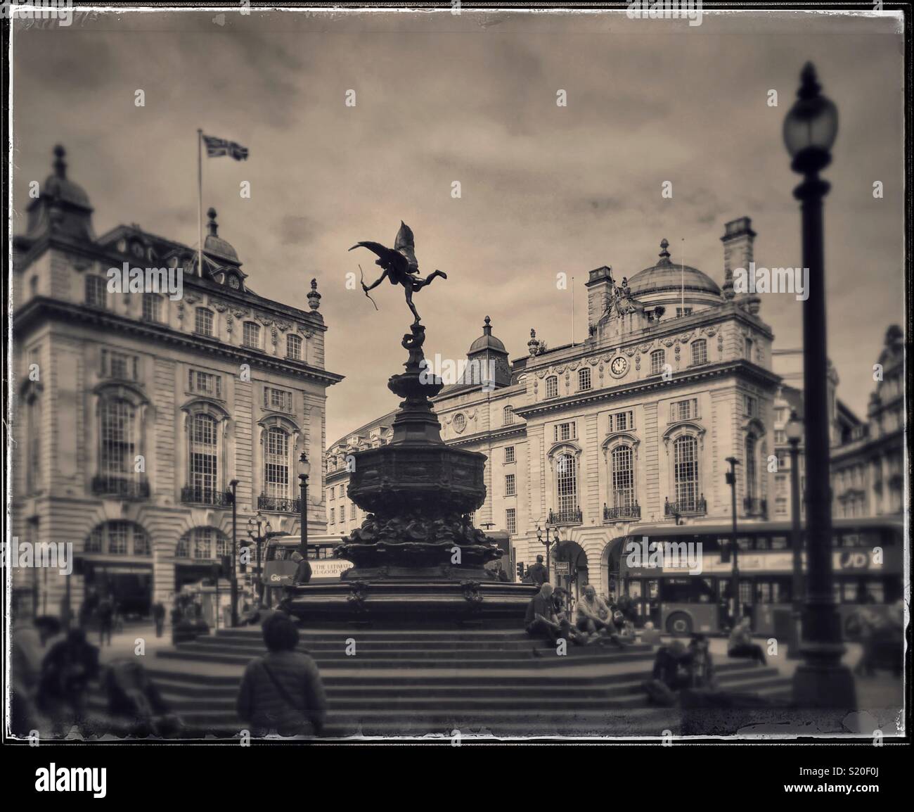 A film retro effect view of the Statue of Eros, in Piccadilly Circus, Central London, England. Photo Credit - © COLIN HOSKINS. - Smartphone Captured Stock Image