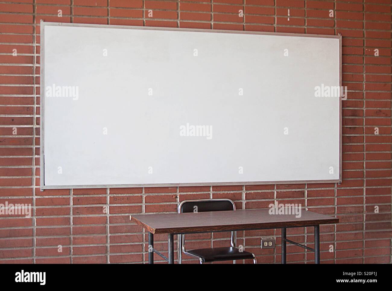 Whiteboard and empty Teachers desk - Smartphone Captured Stock Image