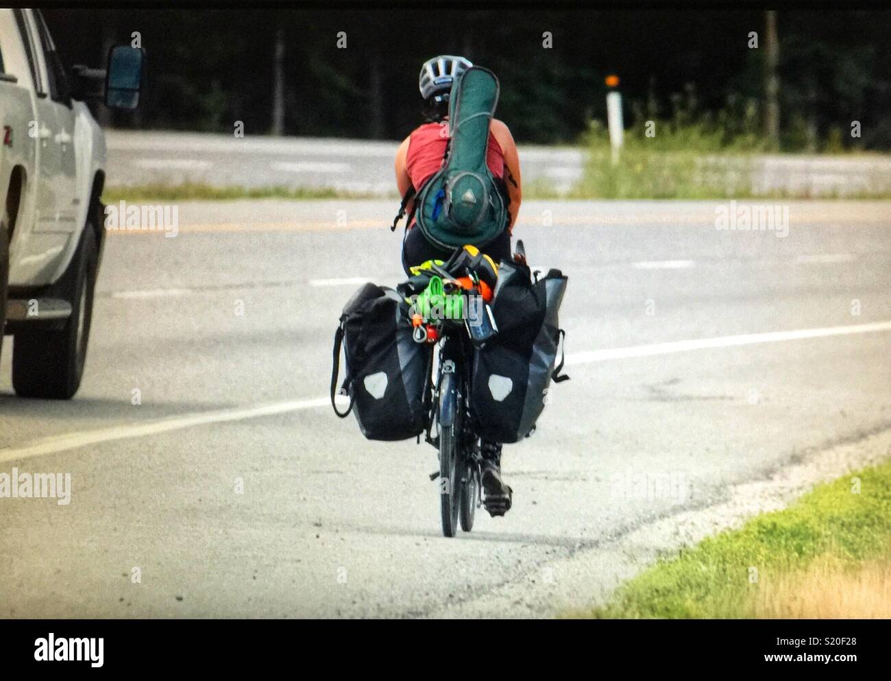 Man on a bicycle with a mandolin - Smartphone Captured Stock Image