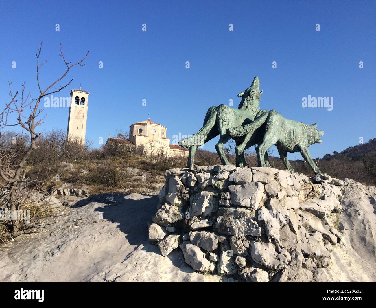 Wolves and church at San Giovanni di Duino. Trieste, Italy. Stock Photo