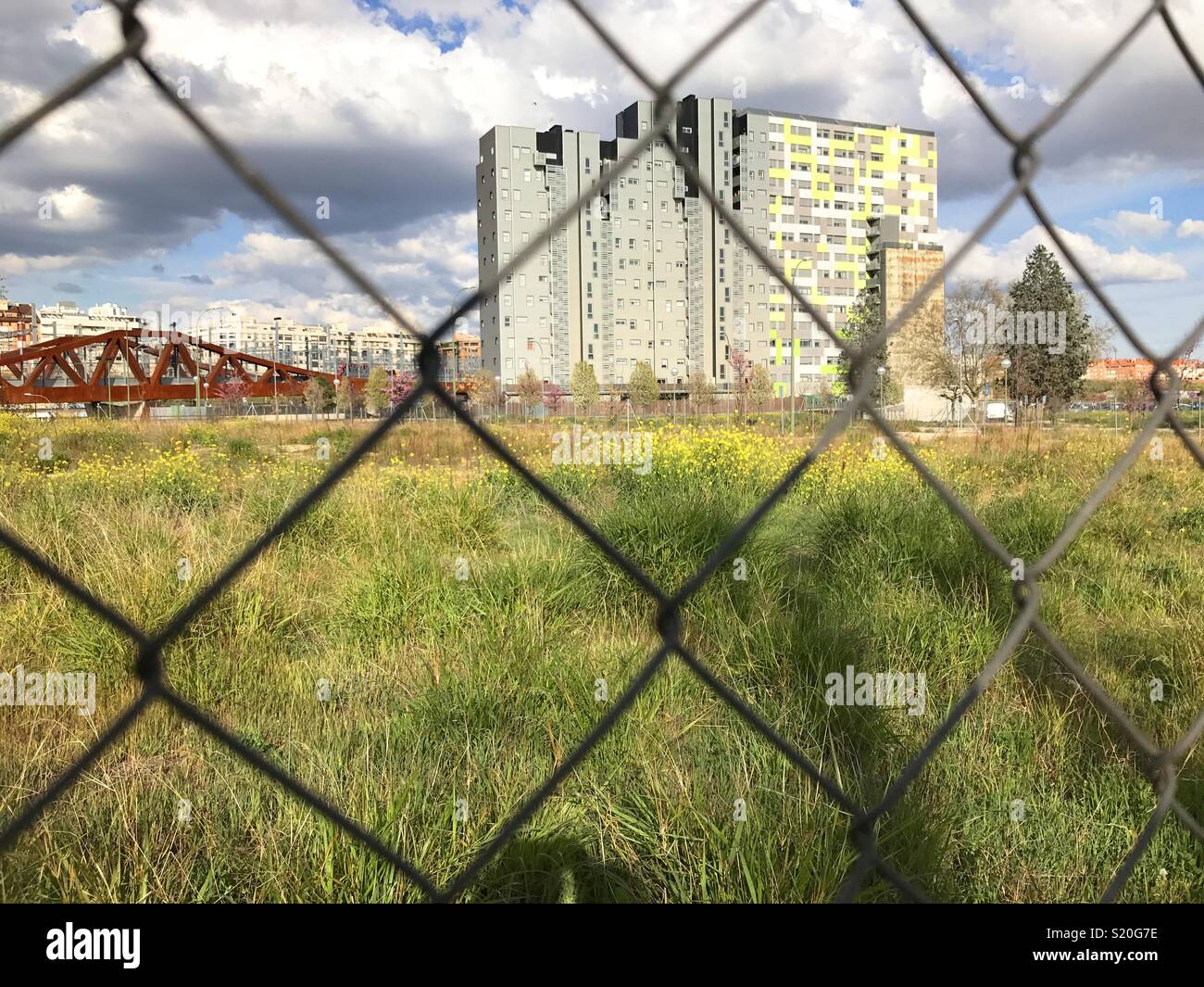 Building viewed  through a wire mesh. - Smartphone Captured Stock Image