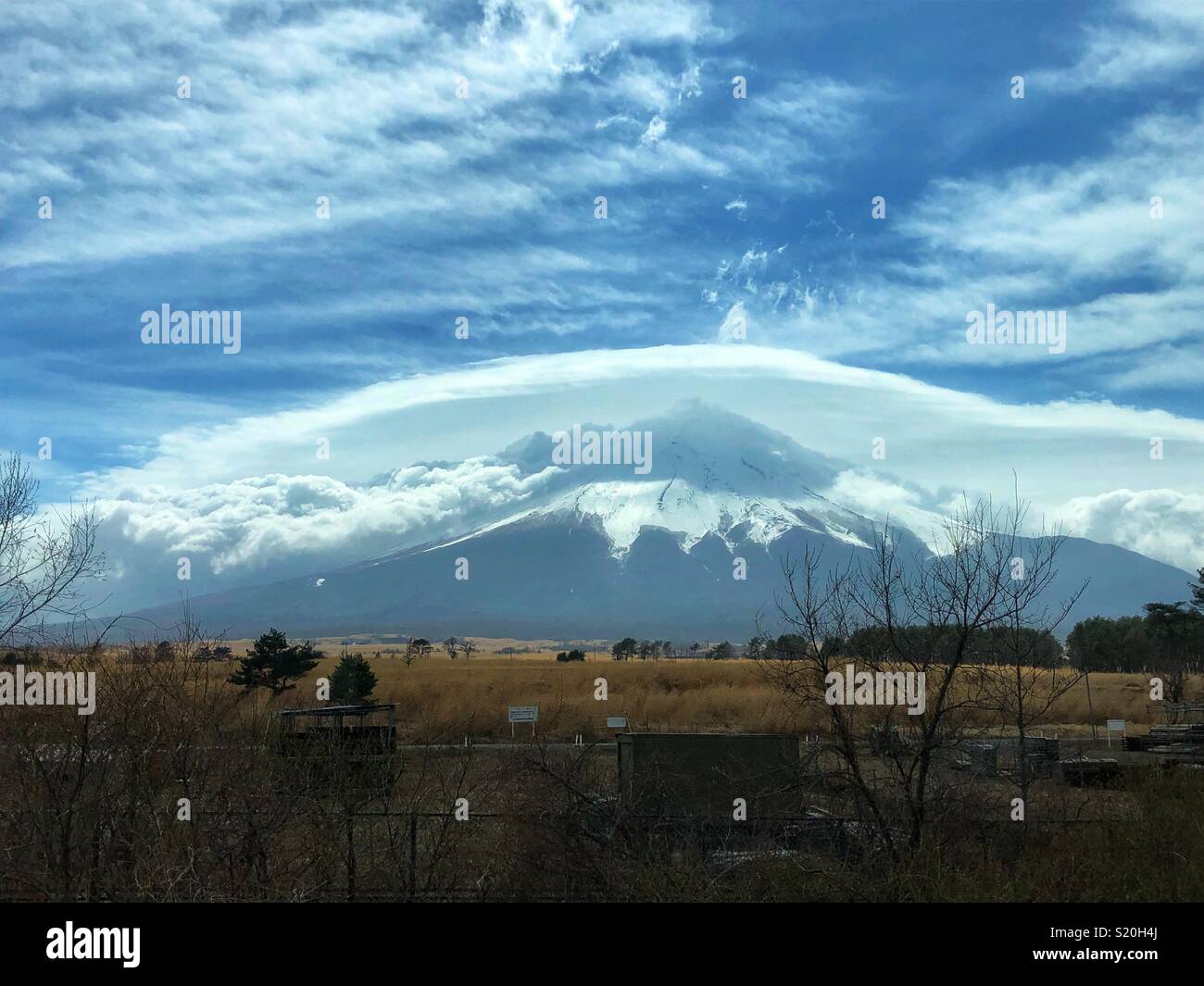 A beautiful view of Mount Fuji slightly covered by clouds. - Smartphone Captured Stock Image