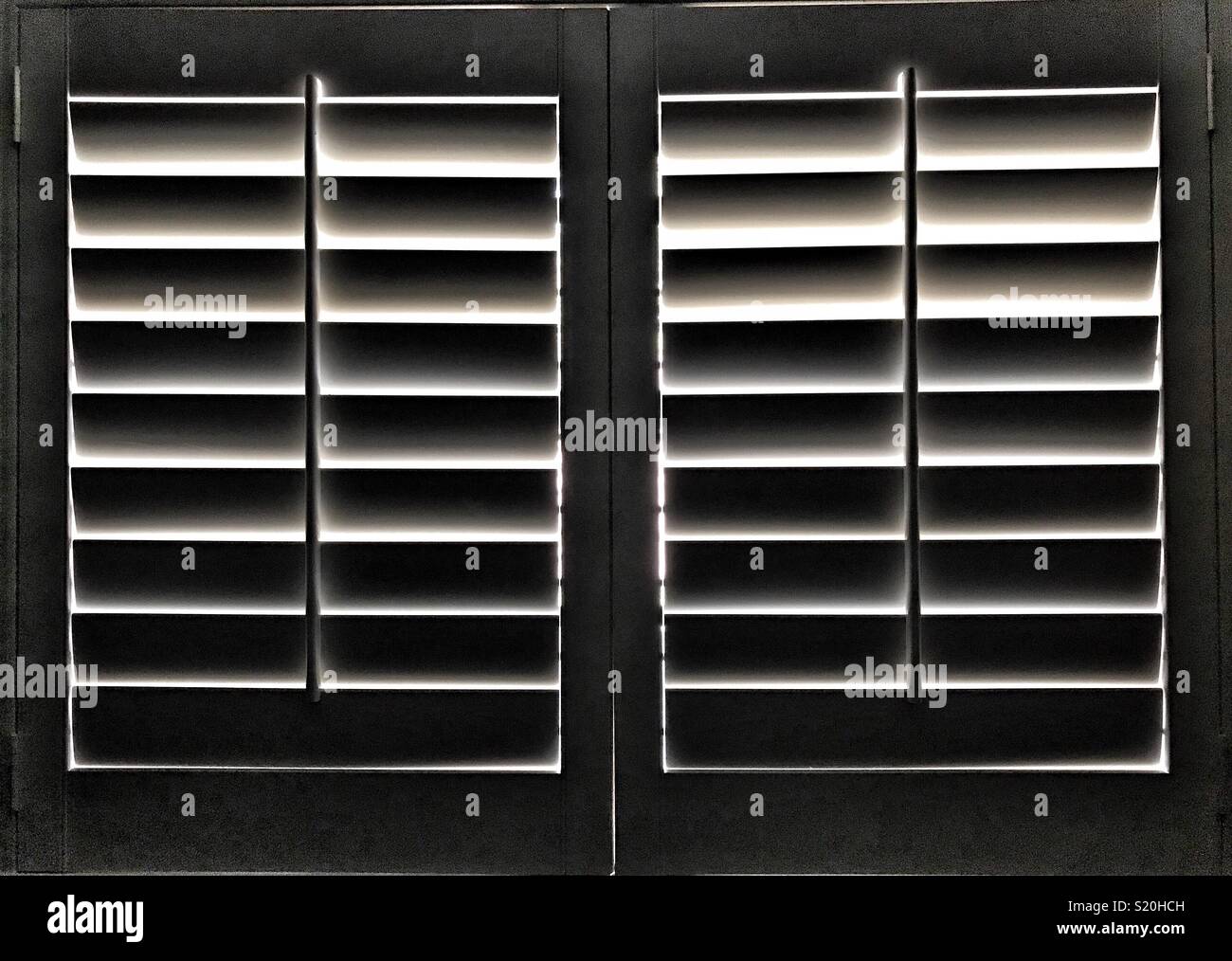 Abstract: light through closed shutters - Smartphone Captured Stock Image