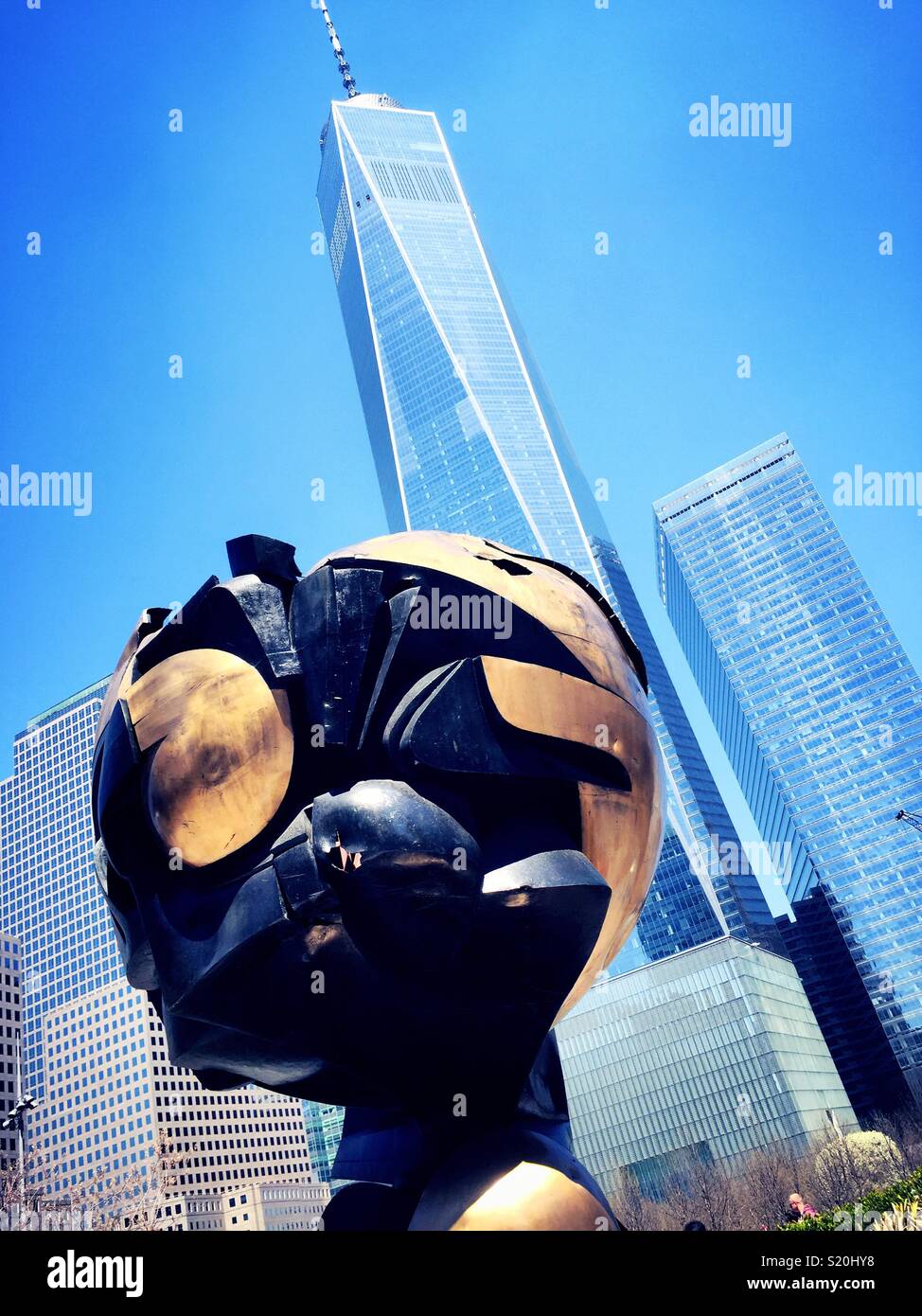 The sphere is in freedom Park at the 911 Memorial in front of the freedom Tower, New York City, USA - Smartphone Captured Stock Image