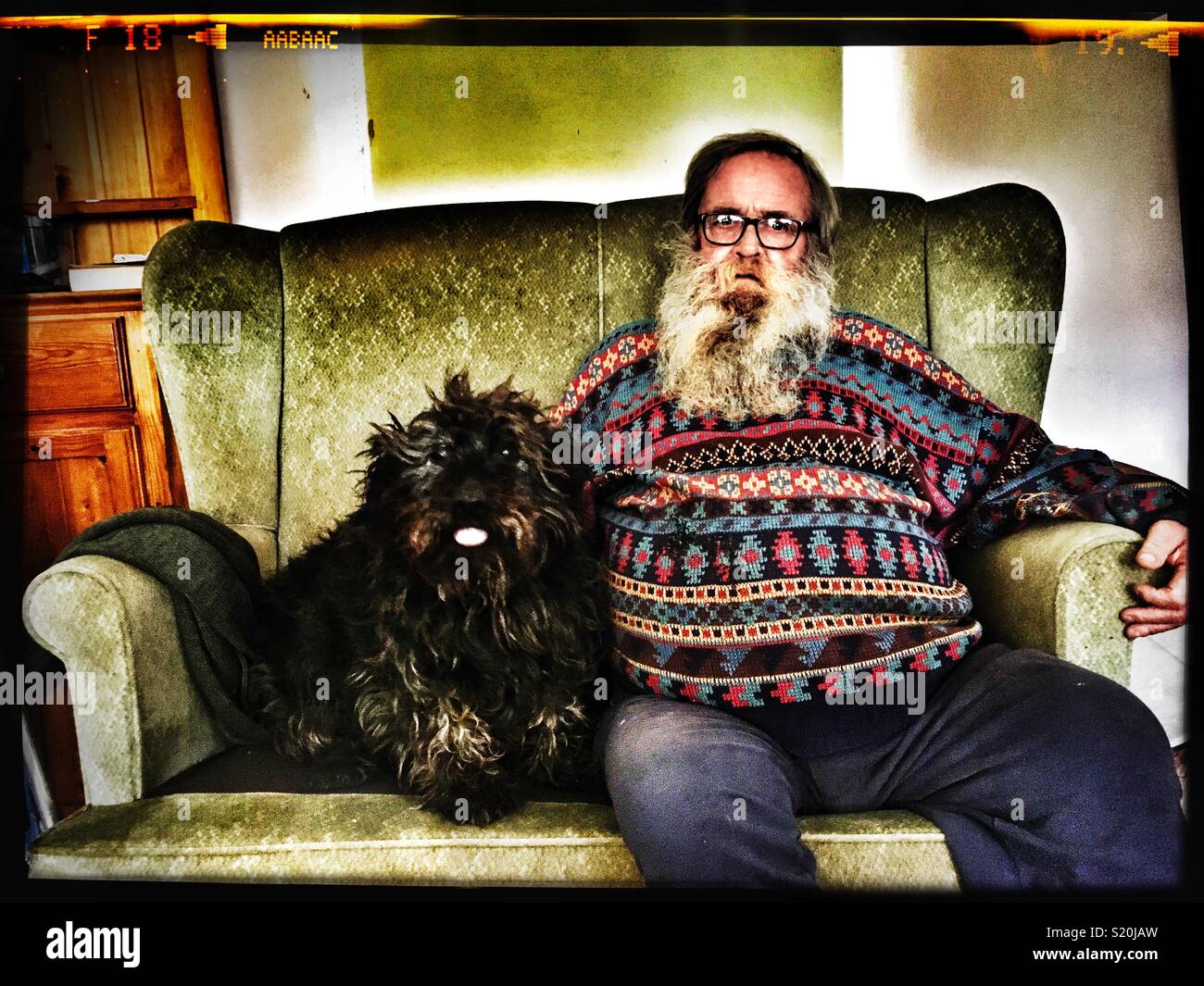 Elderly man with Pedro his pet dog - Smartphone Captured Stock Image