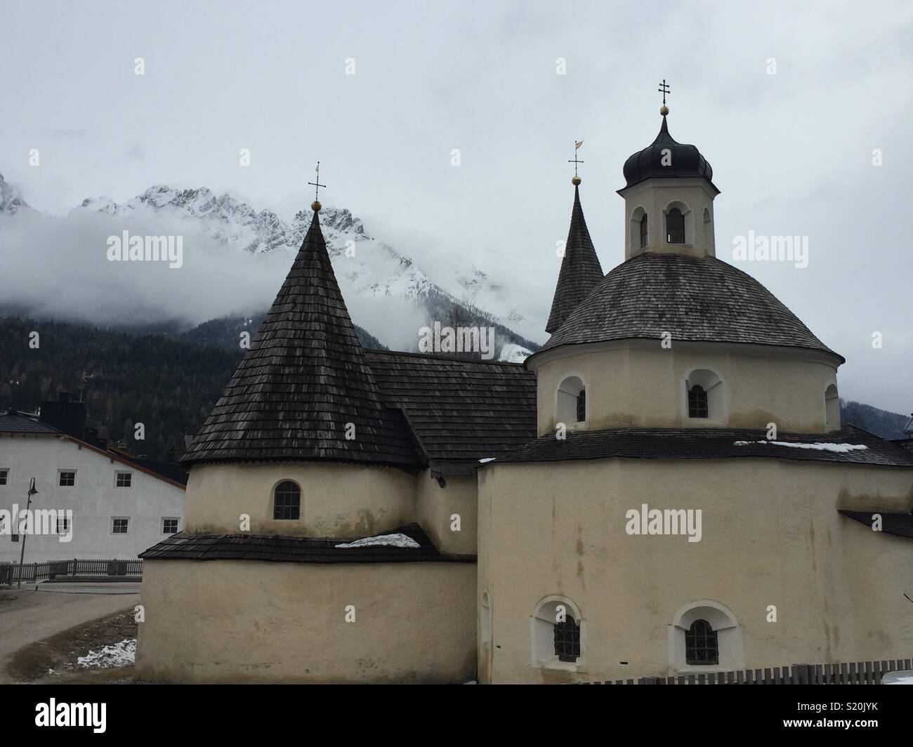 Convent church of San Candido on a cloudy day. Stock Photo