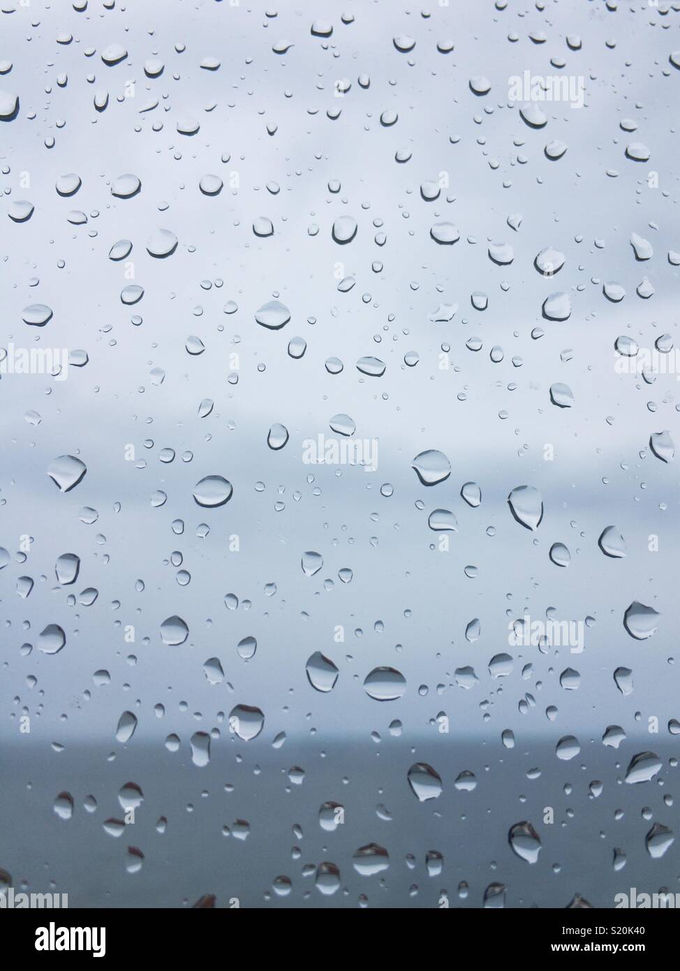 Rain drops on window close up Stock Photo