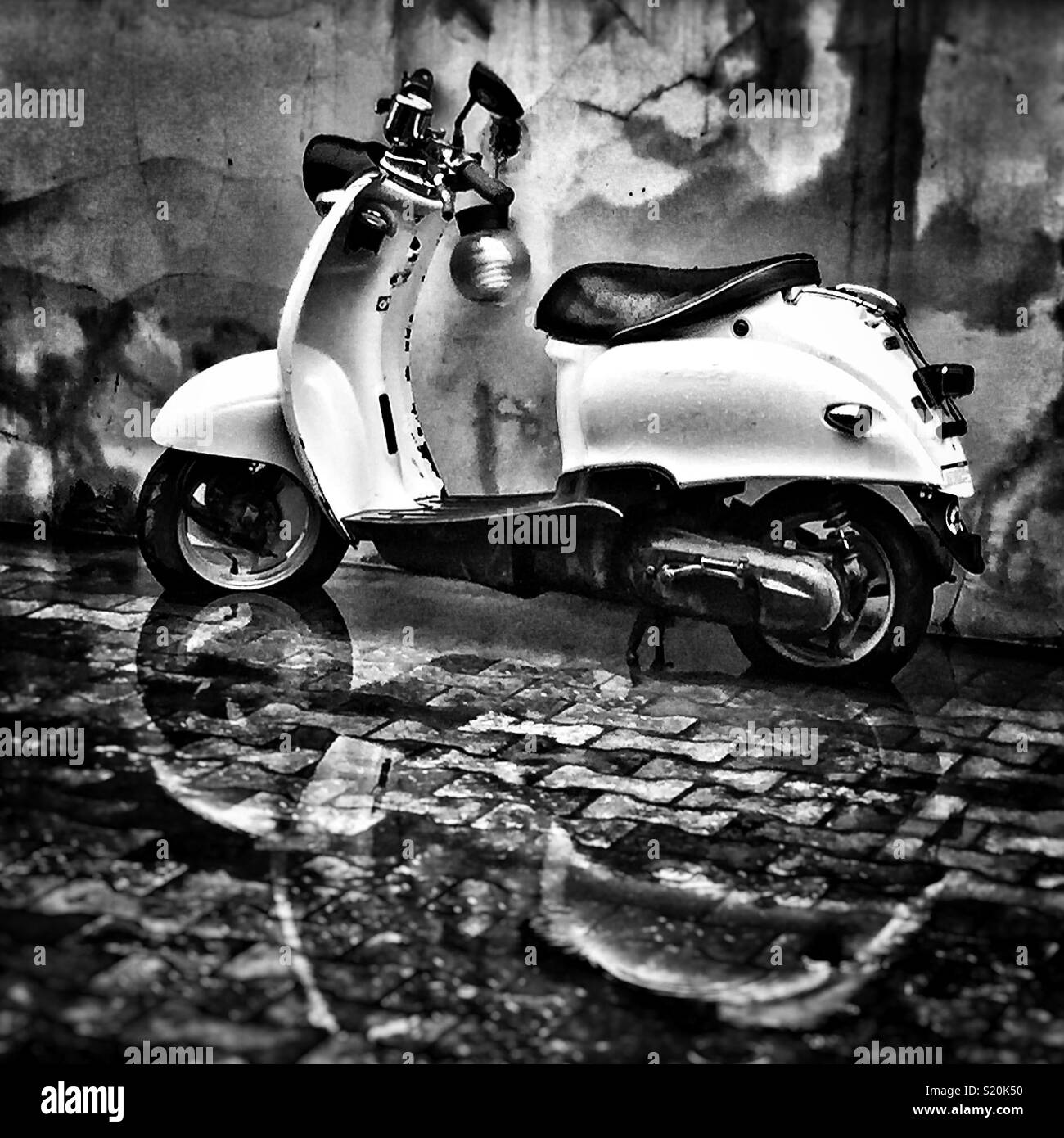 Scooter in the wet Stock Photo Alamy