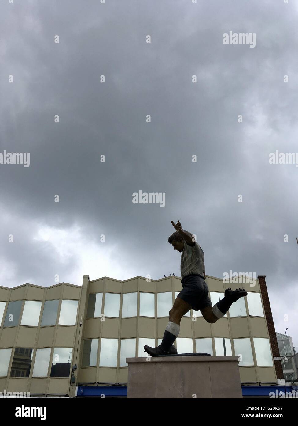 Statue in Dudley town centre of Duncan Edwards (1936-58), played for England 18 times and Manchester United 175 times. Born in Dudley. Killed in Munich air disaster.  - Smartphone Captured Stock Image