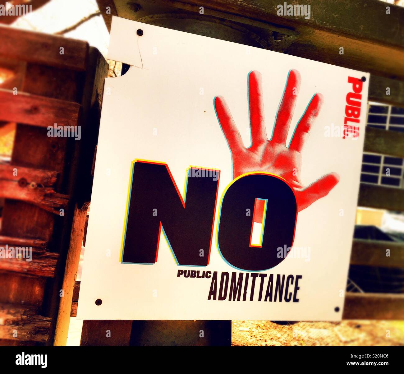 Graphic warning sign of no public admittance was symbolic bright red hand, USA - Smartphone Captured Stock Image
