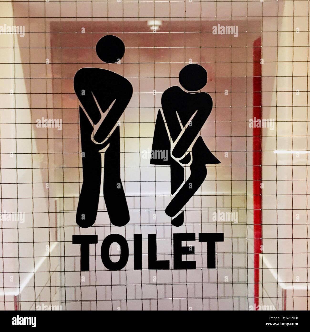 A funny bathroom toilet sign Stock Photo